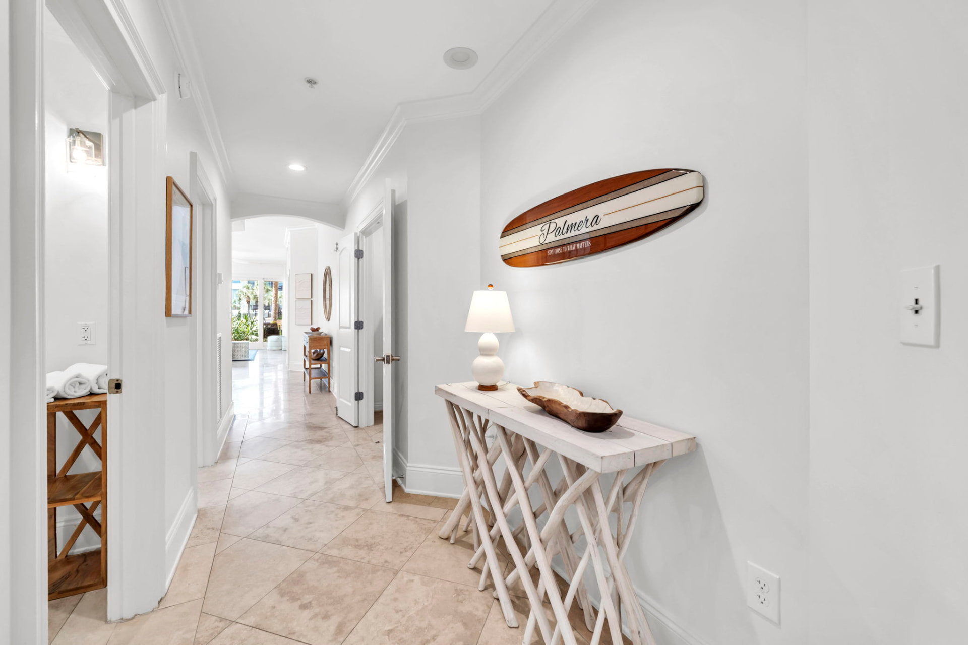 Welcome to Palmera surfboard in the entry hall at Palmera at Adagio 30A